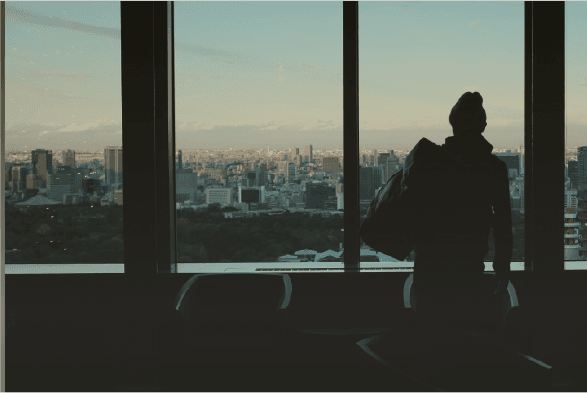 Business professional overlooking city